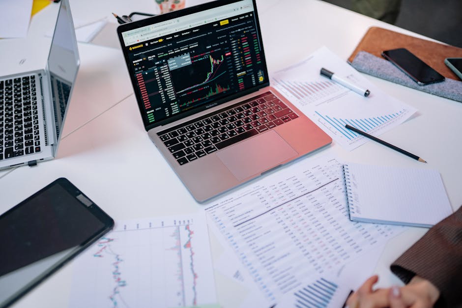 Finance documentary research desk with charts and laptop