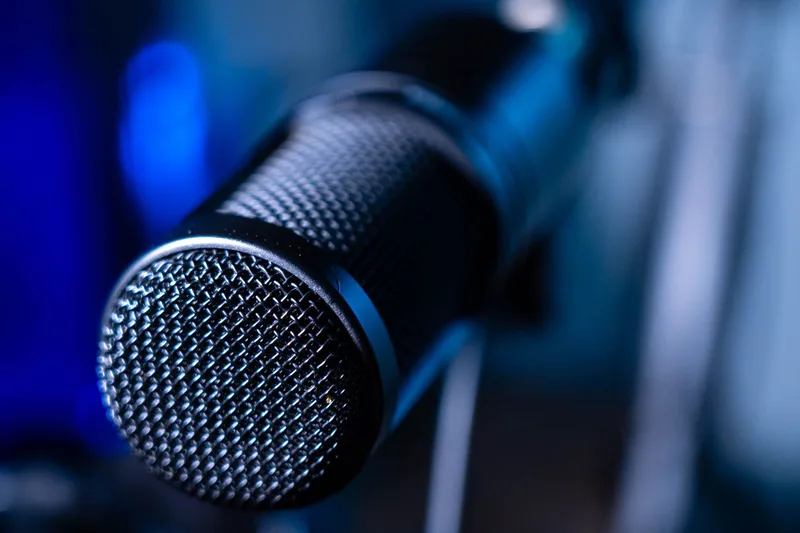 Professional microphone and audio equipment in a recording studio environment