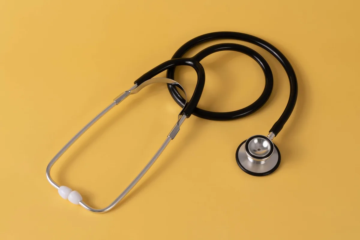 Close-up of a stethoscope on a surface, symbolizing health and wellness content