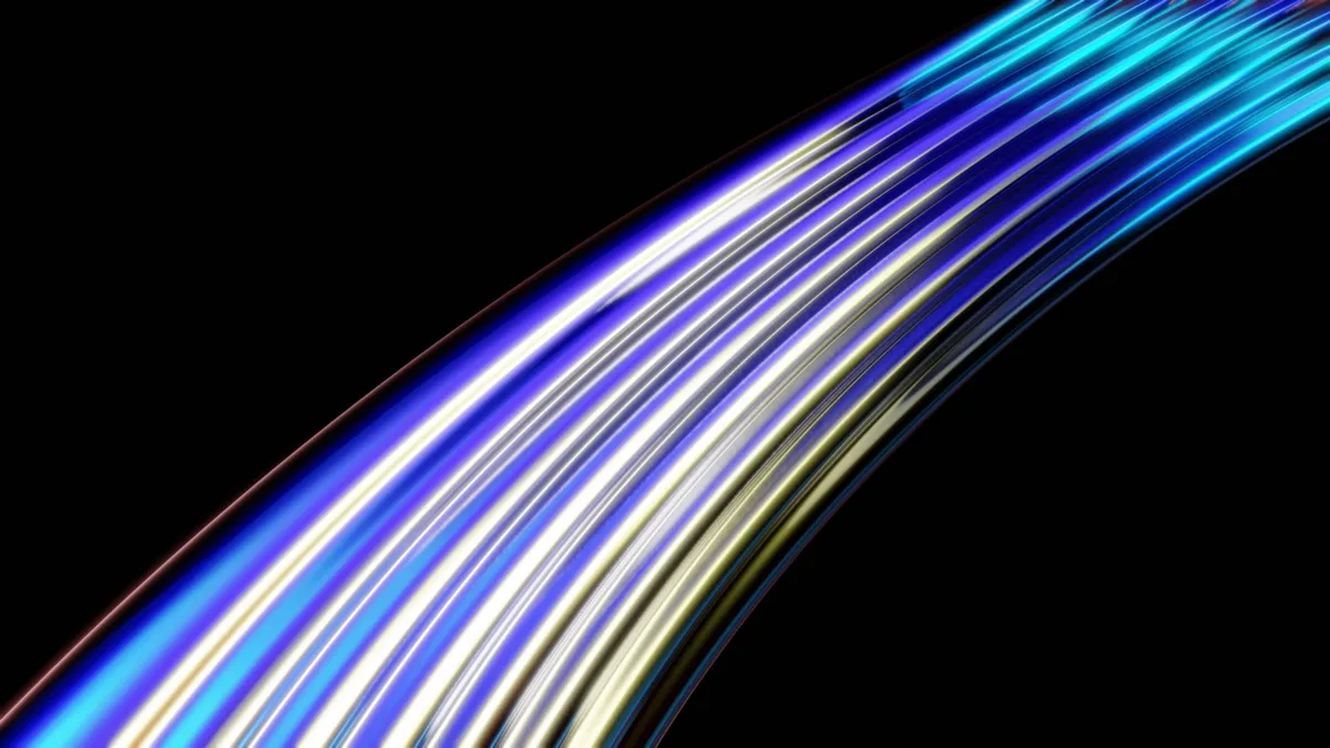 Vibrant curved light trails in blue and yellow on a dark background, representing AI-generated motion and video effects