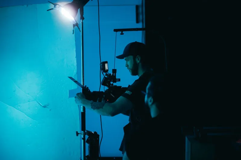 Film production camera equipment and studio lighting setup representing B-roll production workflow without a visible presenter
