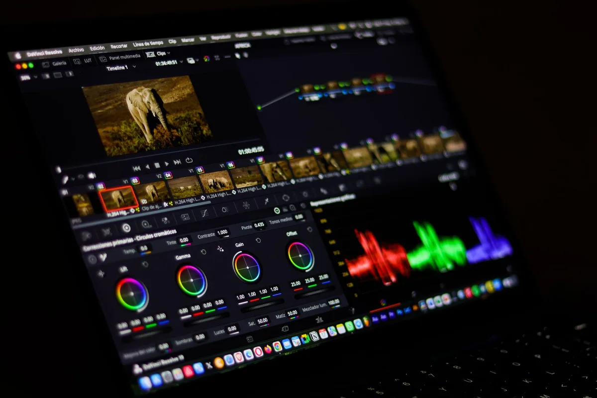 Professional video editing software interface showing colorful waveforms and timeline tracks for AI video production