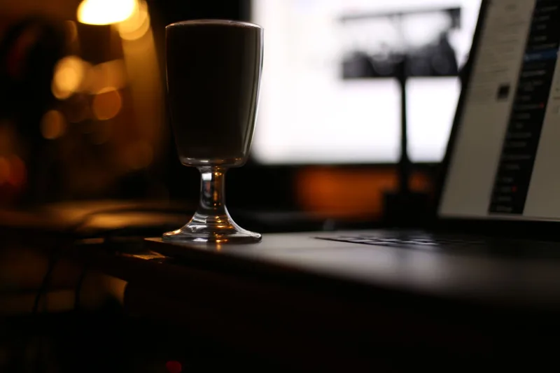 Dark laptop workspace representing creative technology setup for faceless YouTube content production workflow