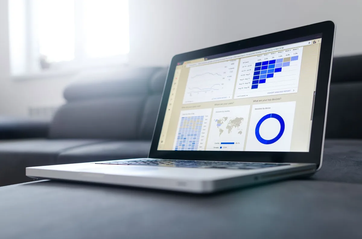 Laptop displaying a data analytics dashboard used for YouTube channel research