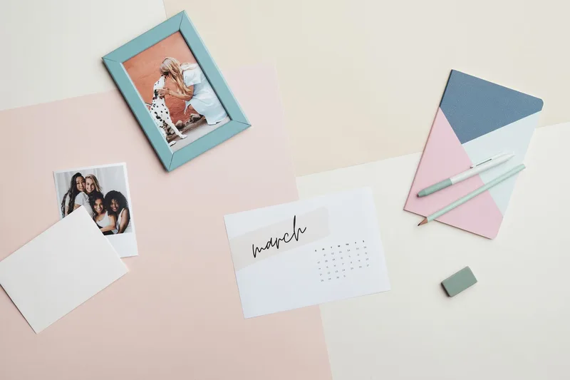 Calendar and stationery flat lay representing content planning and topic organization for YouTube