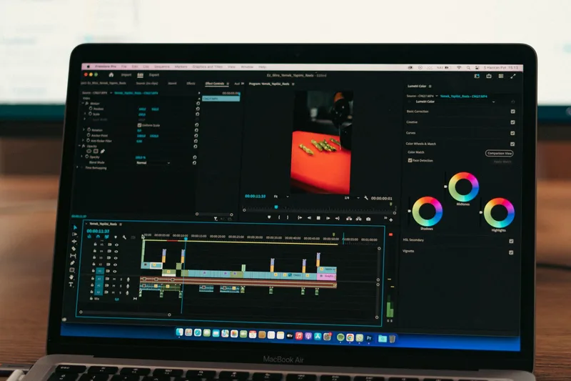 Close-up of video editing software on a laptop screen in a professional workspace